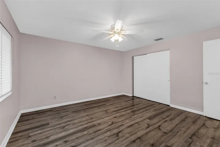 Primary Bedroom with luxury plank flooring