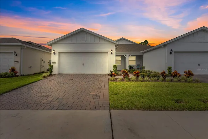 Home front with paver driveway.