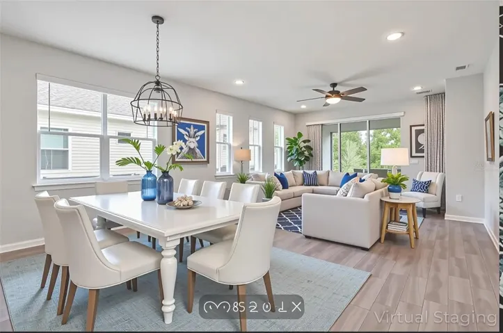 Dining area looking down to Livingroom. NOTE: VIRTUALLY STAGED- living room windows new length.