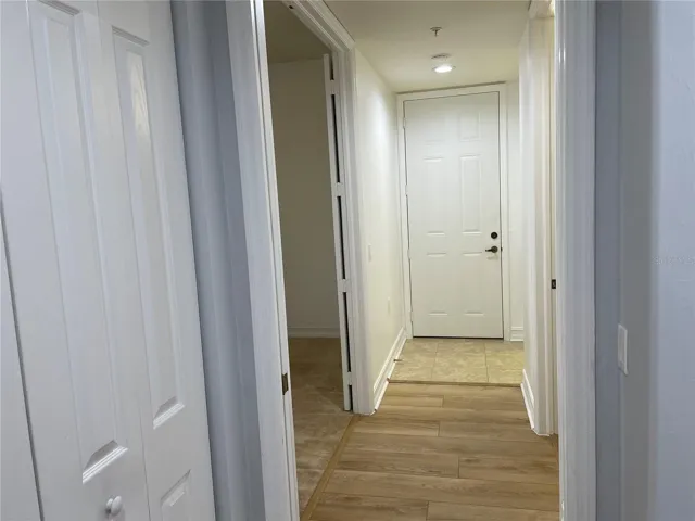 Hallway to the 3rd bedroom, guest bath, laundry room and back door.
