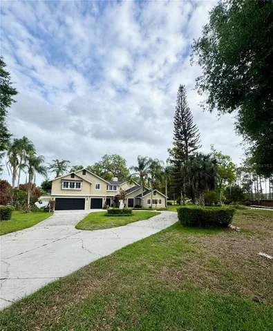 PLENTY OF PARKING IN OVERSIZED CIRCULAR DRIVEWAY