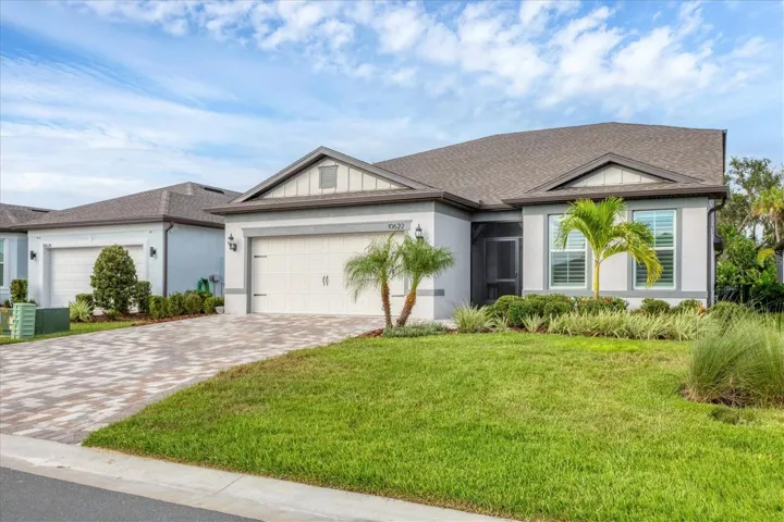 The entryway features a screened enclosure, providing added comfort and protection from the elements.