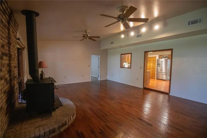 Family room with wood flooring.