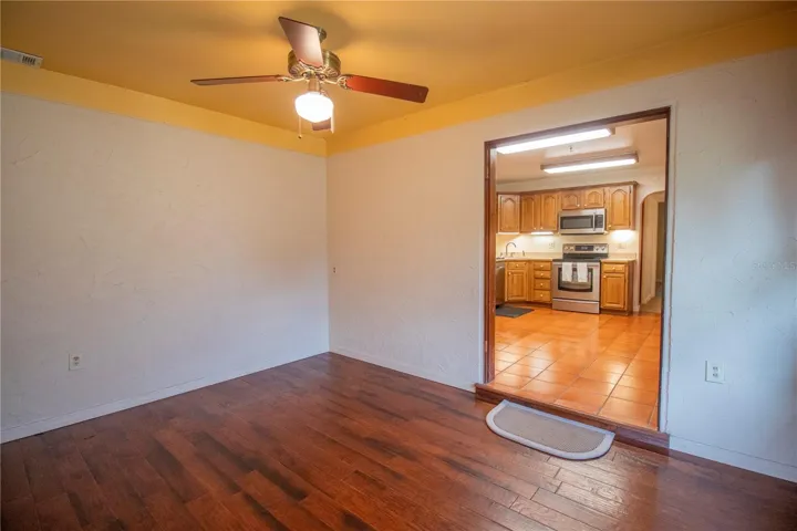 Bedroom four with wood flooring.