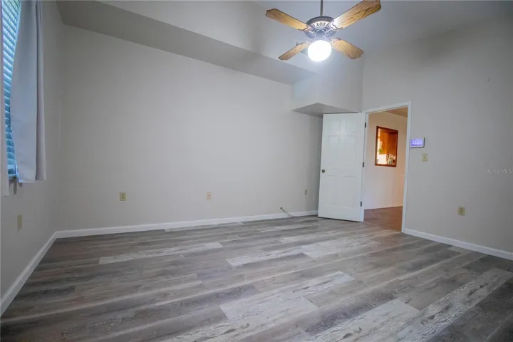 Remodeled Primary bedroom with Luxury Vinyl flooring.