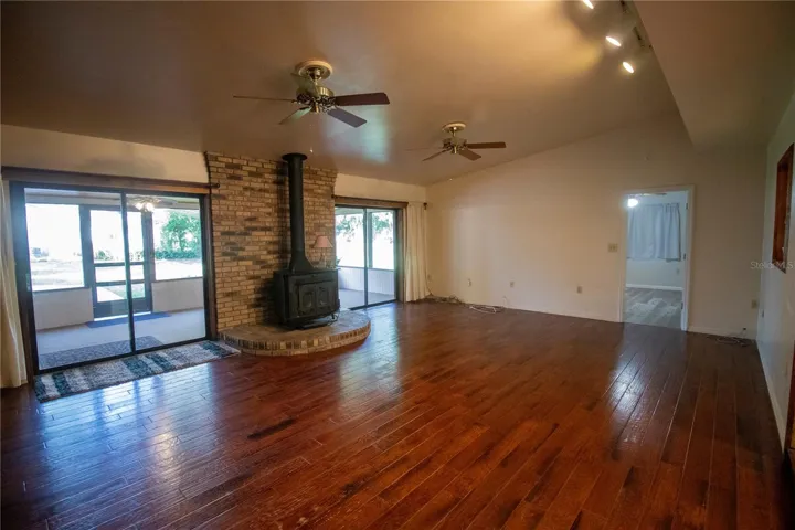 Beautiful wood flooring and exit to the patio.