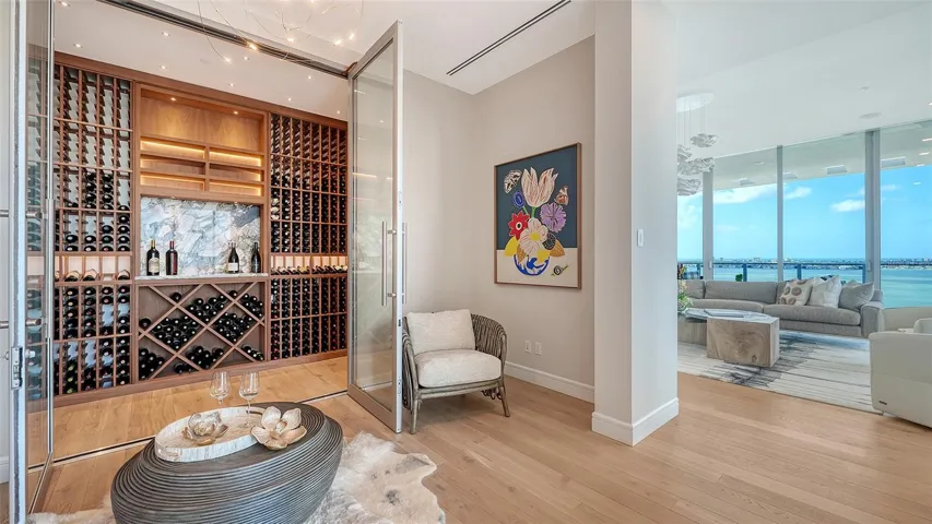 1600 bottle capacity temperature controlled wine room with tasting nook adjacent to the Primary suite