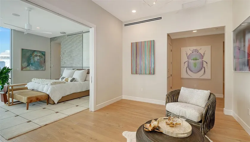Cozy seating area welcomes you to the Primary suite. Perfect for a glass of wine and a quiet chat.