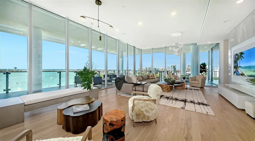 The interior spans over 5600 square feet. Floor-to-ceiling glass windows frame a breathtaking waterfront &amp; cityscape, creating a seamless connection between indoor elegance and outdoor beauty.
