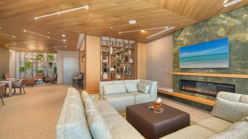 Resident’s Club room with complete Gaggenau™ kitchen, TV, wifi, lounge seating &amp; fireplace