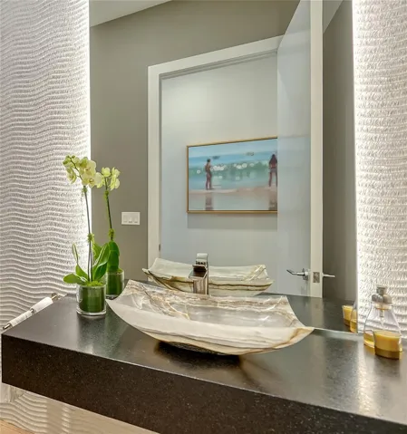Hand carved onyx sink adds sophistication to the powder room