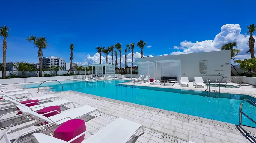 Resort-style pool terrace with 70’ lap pool, spa, cabanas, granite poolside bar, 2 gasgrills, dining areas, fire tables