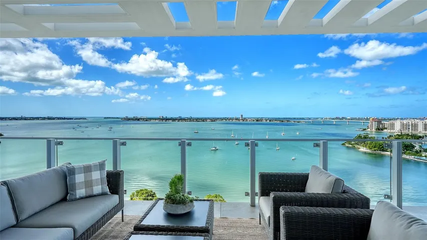 Claim your front-row seat to nature’s masterpiece! With nearly 2,000 square feet of wraparound terrace, enjoy breathtaking views as Sarasota’s shoreline embraces the Bay and the vibrant energy of Downtown unfolds before you
