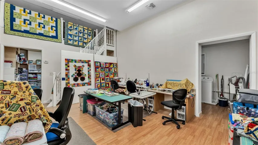 Bonus room in the 2/1 apartment. Extra room straight back, bonus room up in the loft and laundry room to the right