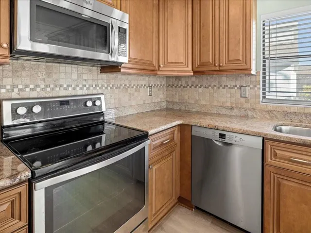 APPLIANCES REMAIN, INCLUDING WASHER AND DRYER.