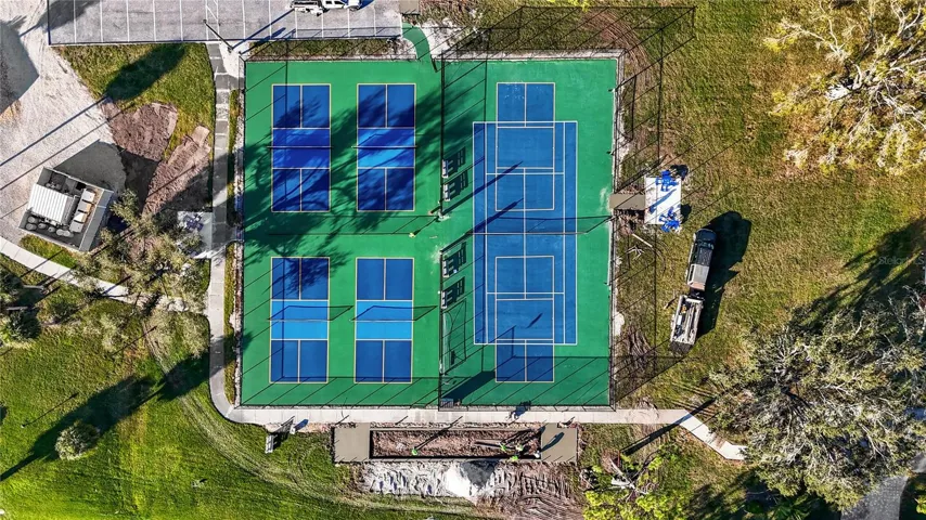 AERIAL VIEW OF PICKLEBALL & TENNIS COURTS. THE  BOCCE BALL COURT ON THE RIGHT HAS RECENLTY BEEN COMPLETED