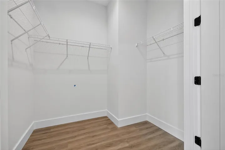Primary Bedroom walk-in closet