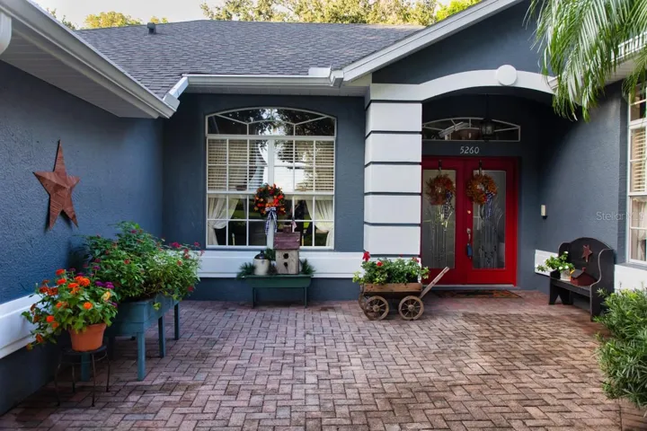 Close-up of spacious front paver patio