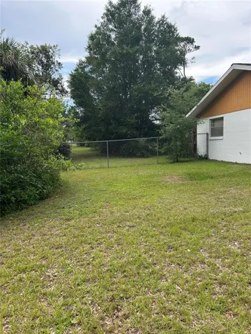 West part of house facing north showing fence.