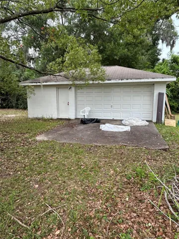 Detached block two car garage facing east.