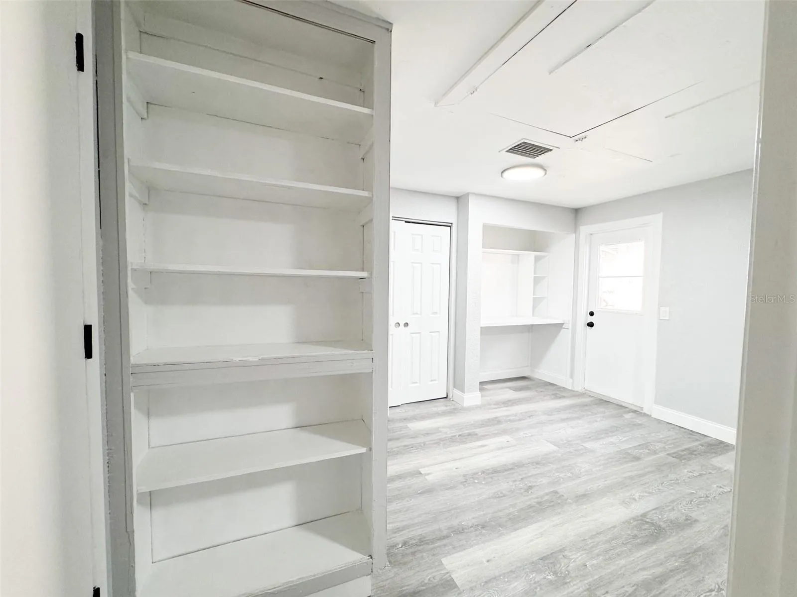Primary Closet #1, Work area and Bookshelf.