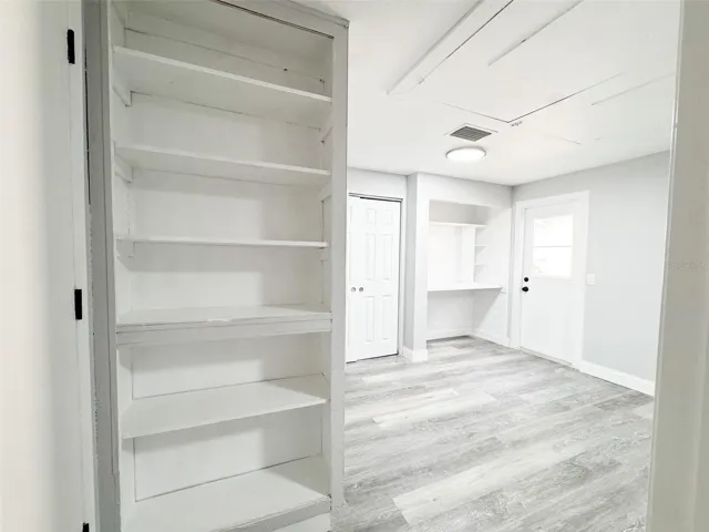Primary Closet #1, Work area and Bookshelf.