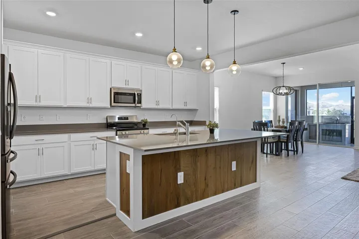 Kitchen with plentiful cabinet storage and easy access to dining area