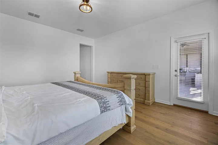 Primary bedroom with access to screened lanai