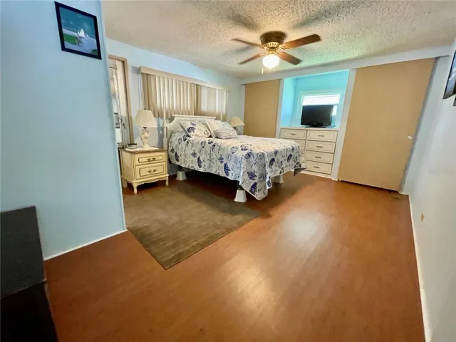 Primary bedroom, features 3 closets, showing 2 closets and built in dresser here