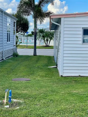 The pool can be seen from the back of the home, well within walking distance