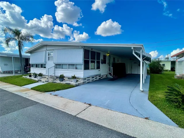Plenty of carport space for at least 2 cars. The Florida room is at the front of the home, surrounded by windows.