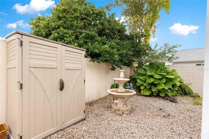 Water fountain and shed in left back corner outside LANAI