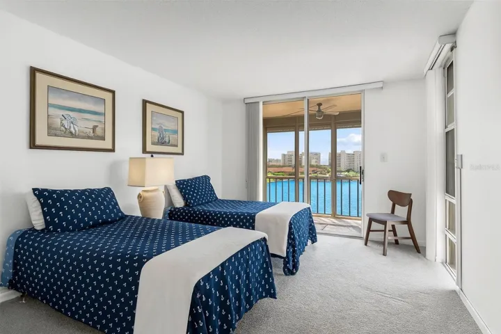 THE SECOND BEDROOM IS LARGE WITH A LOVELY SCREENED BALCONY WITH FABULOUS WATER VIEWS!