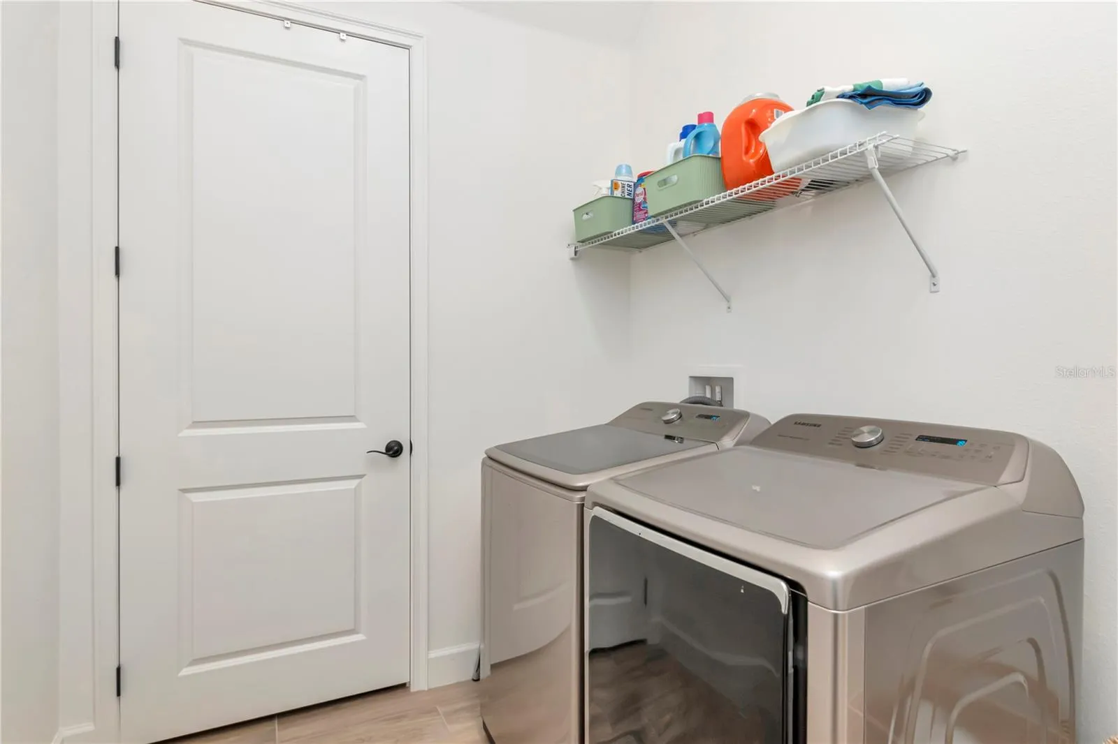 Huge Laundry Room with large storage closet