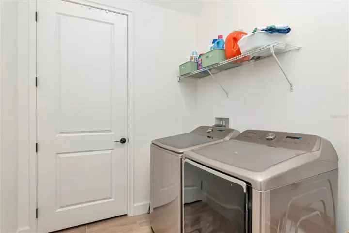 Huge Laundry Room with large storage closet
