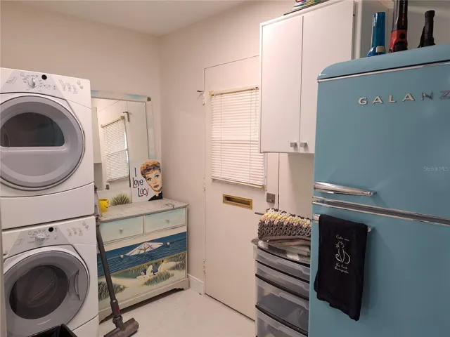 Designated Laundry Room with additional fridge and large pantry.