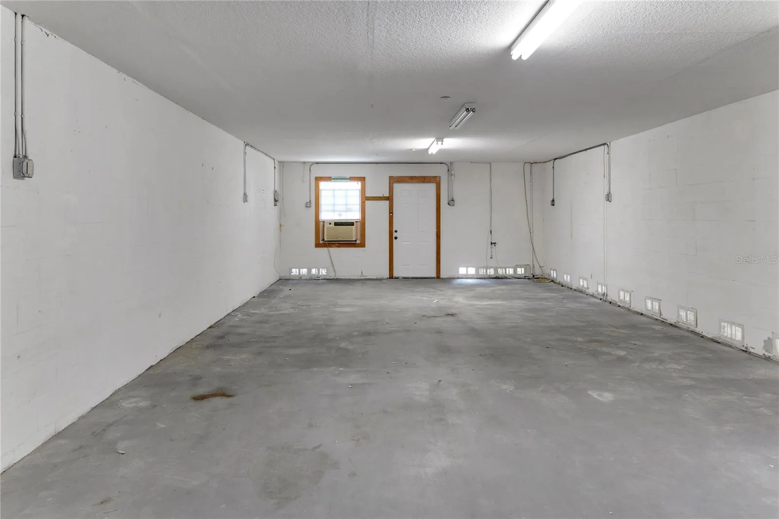 Rare 2-car garage with storage closet-ideal for beach gear, bikes, and storage.
