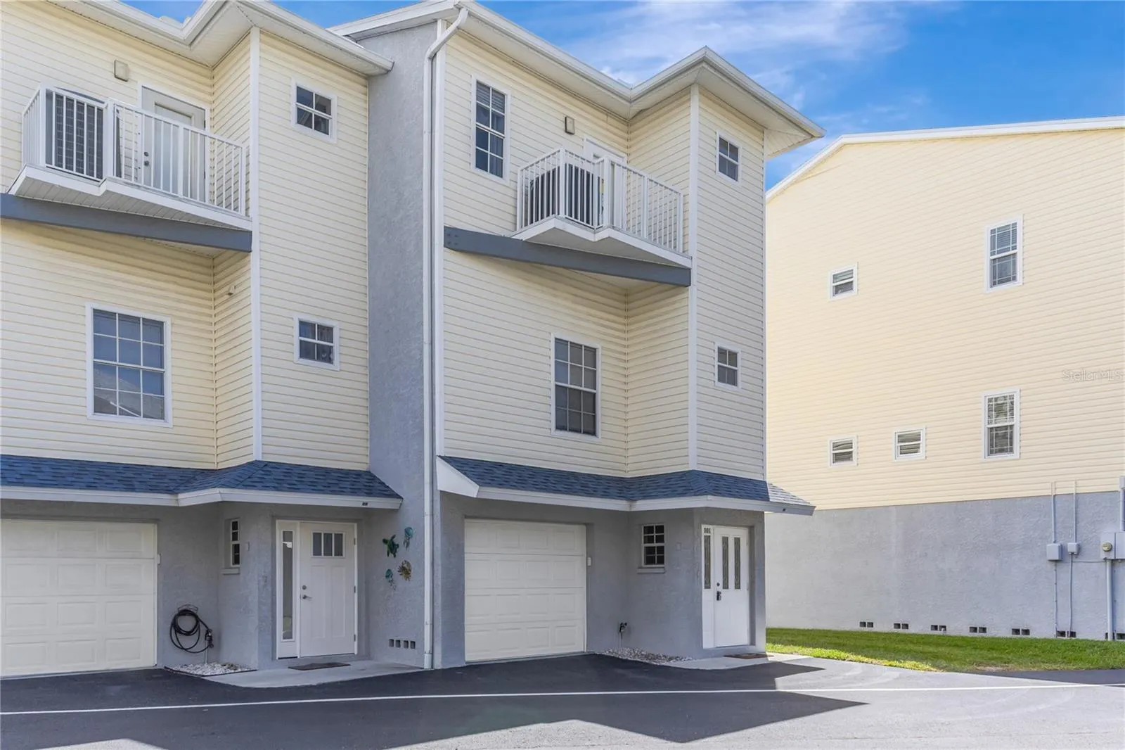 Rare end-unit townhome with water views and direct beach access just steps away.