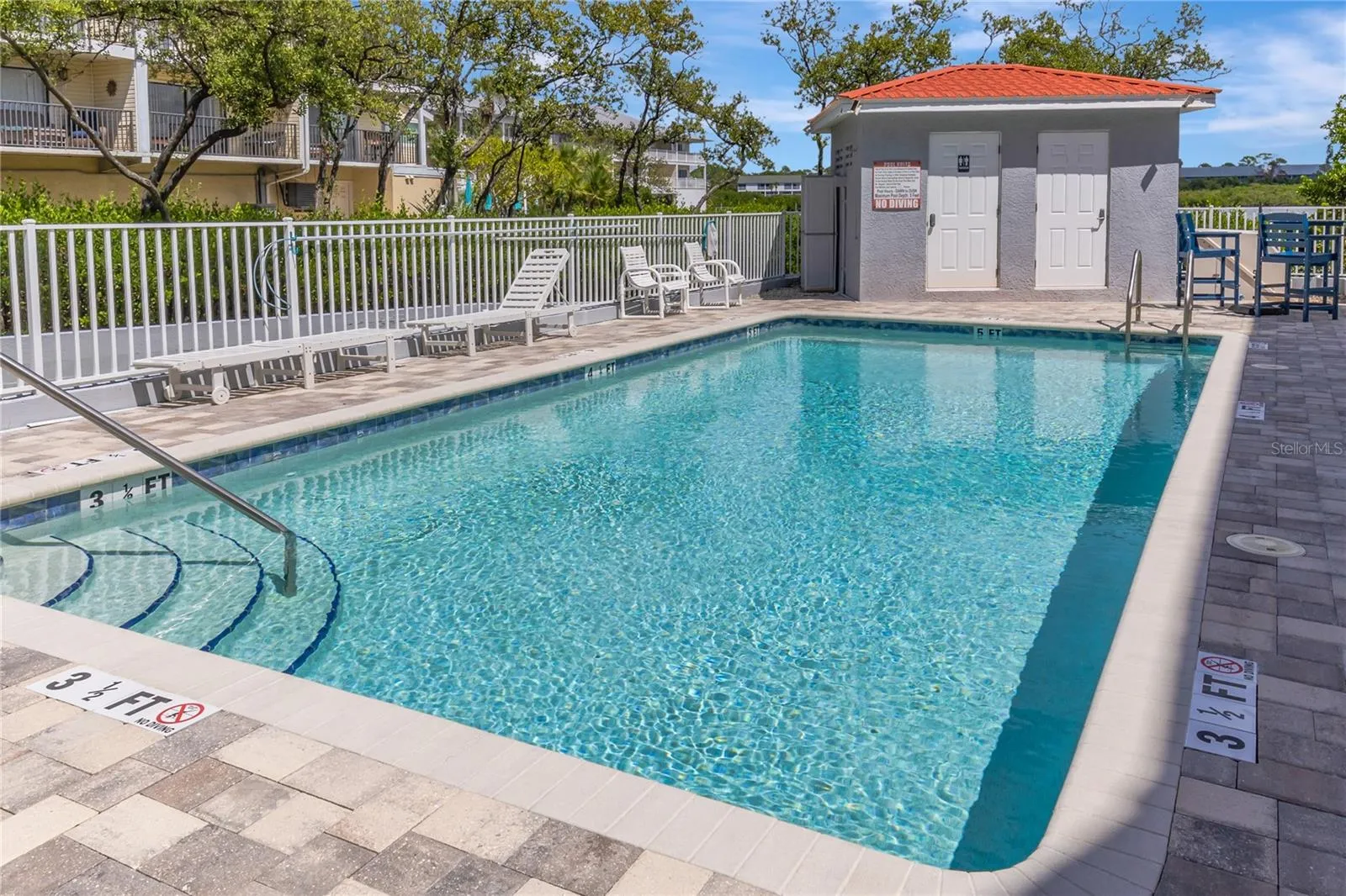 Relax at your quaint communities private pool oasis.