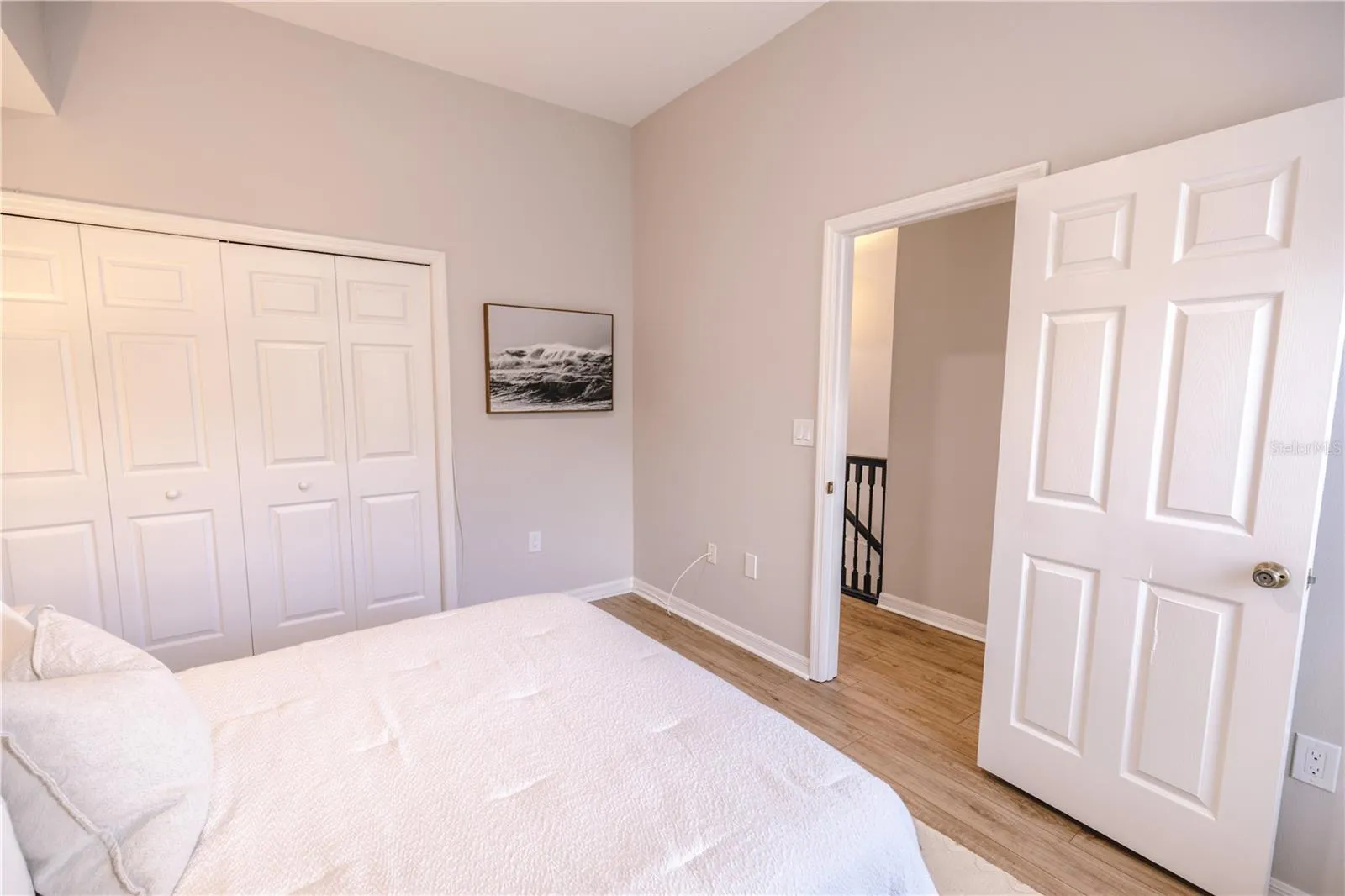Light filled bedroom with generous storage and easy access to a full bath.