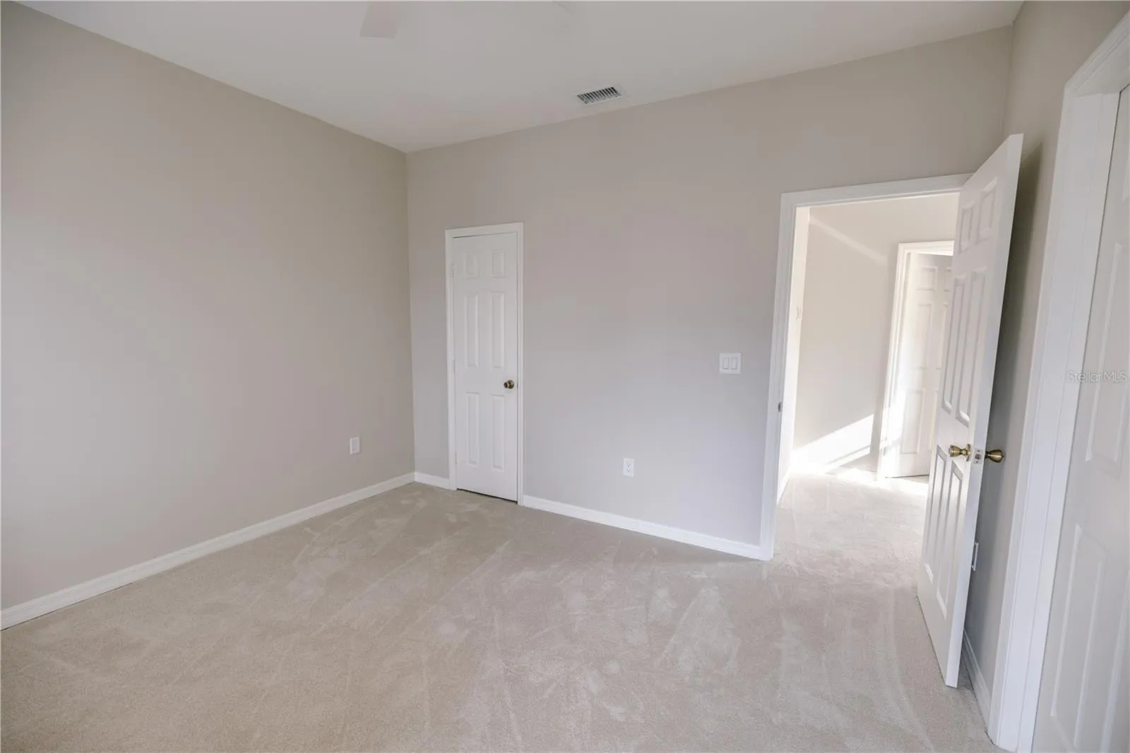 Third floor guest suite with spacious closets and a serene ensuite bath.