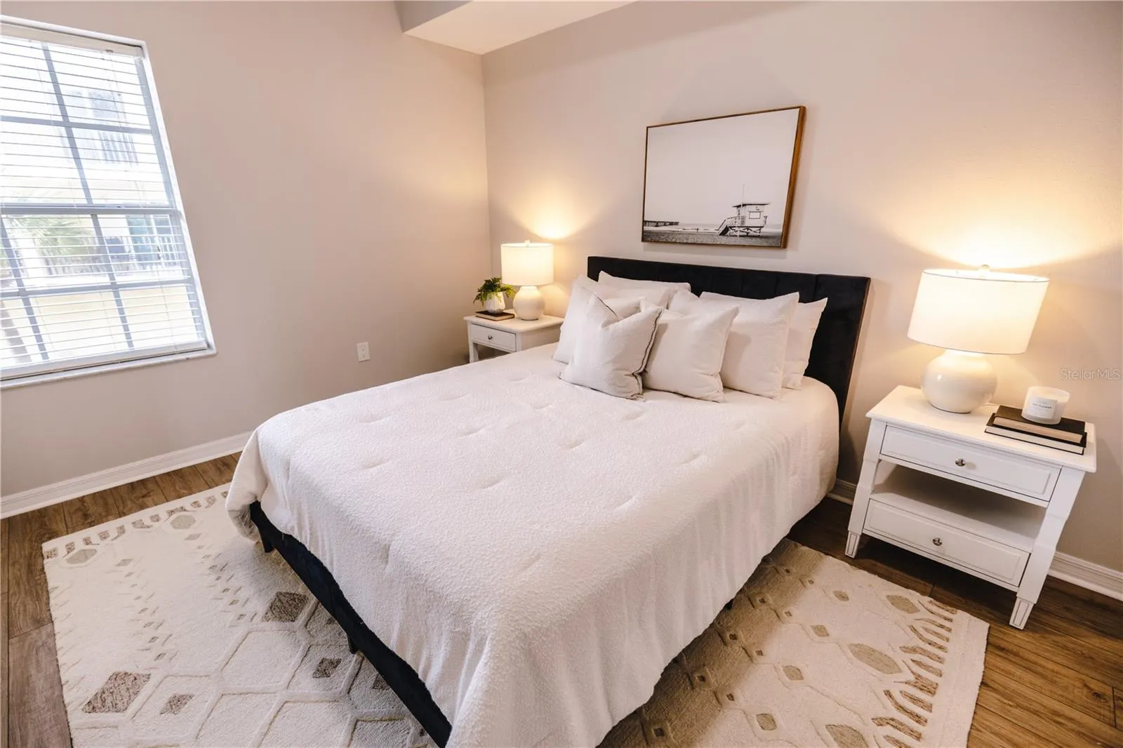 Light filled bedroom with generous storage and easy access to a full bath.