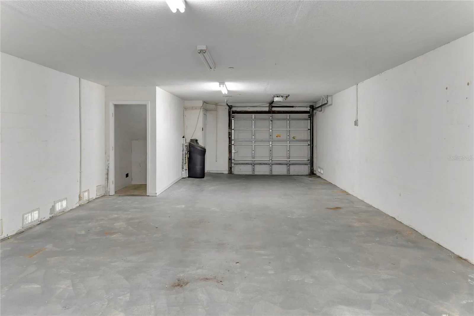 Rare 2-car garage with storage closet-ideal for beach gear, bikes, and storage.