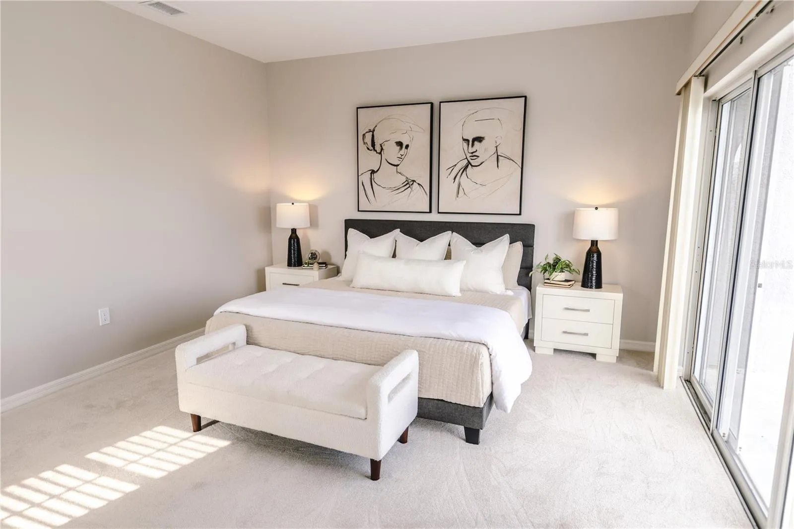 Spacious primary suite with elevated water views and private balcony.