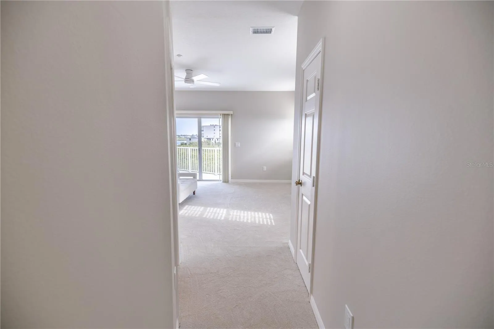 Spacious primary suite with elevated water views and private balcony.