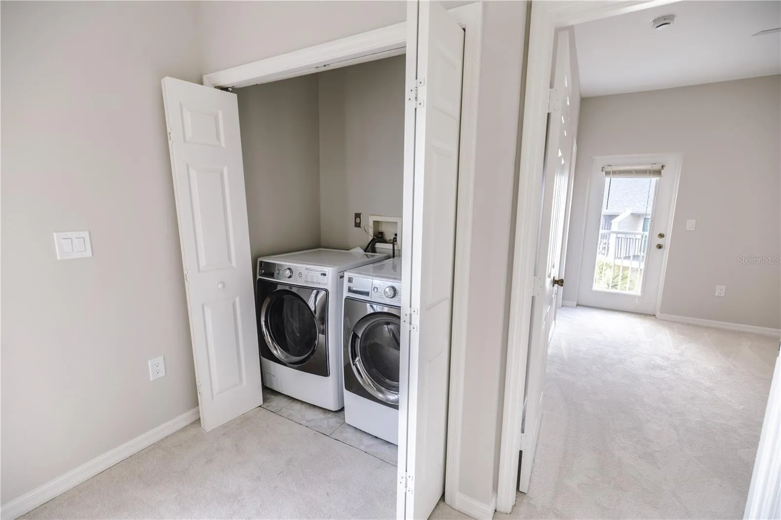 Ideal laundry location by primary suite.