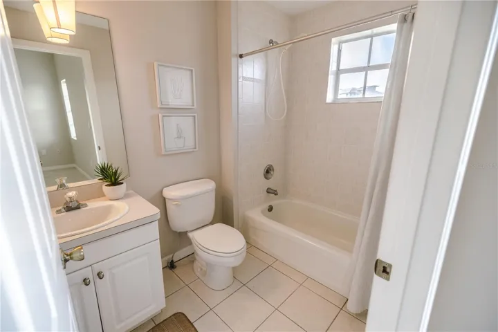 Third floor guest suite with spacious closets and a serene ensuite bath.