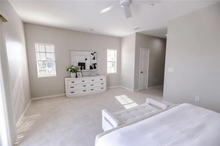 Spacious primary suite with elevated water views and private balcony.