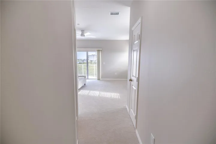 Spacious primary suite with elevated water views and private balcony.
