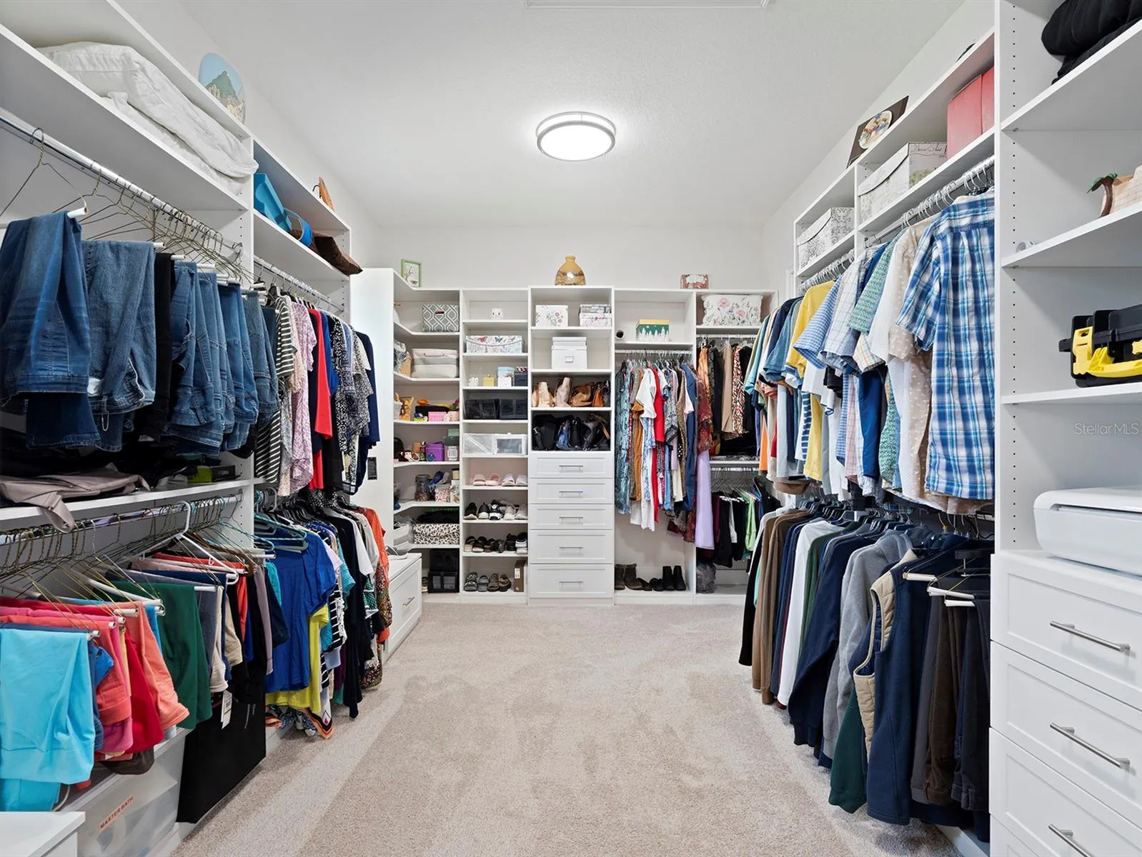 primary closet with tons of built-ins